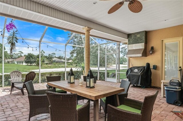 3859 Enchanted Oaks Ln, Sebring, FL 33875 - view of patio / terrace with a lanai, grilling area, outdoor dining space, and ceiling fan