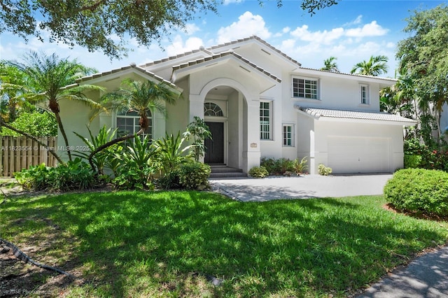 6670 SW 69th Ln, South Miami, FL 33143 - view of front facade with a tiled roof, stucco siding, concrete driveway, and a garage