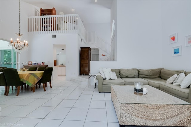 6670 SW 69th Ln, South Miami, FL 33143 - living area with a towering ceiling, a chandelier, stairway, and tile patterned floors