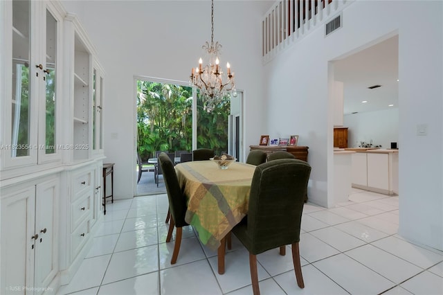 6670 SW 69th Ln, South Miami, FL 33143 - dining area with a chandelier and light tile patterned flooring
