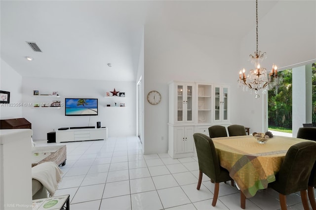 6670 SW 69th Ln, South Miami, FL 33143 - dining area with a chandelier, a high ceiling, and light tile patterned floors