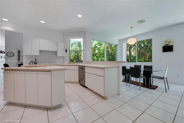 6670 SW 69th Ln, South Miami, FL 33143 - kitchen with dishwasher, white cabinets, healthy amount of natural light, and recessed lighting