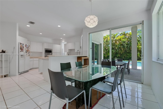 6670 SW 69th Ln, South Miami, FL 33143 - dining space featuring light tile patterned flooring and recessed lighting