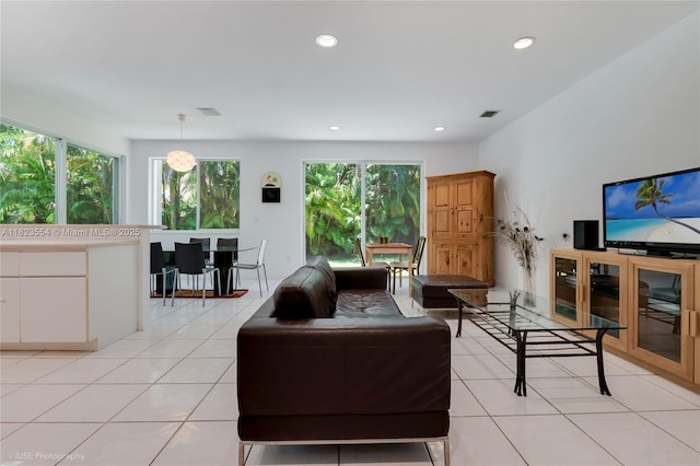 6670 SW 69th Ln, South Miami, FL 33143 - living room featuring light tile patterned floors and recessed lighting