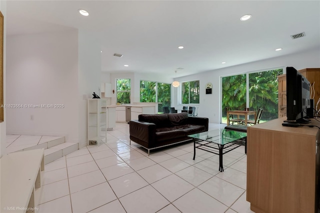 6670 SW 69th Ln, South Miami, FL 33143 - living area with healthy amount of natural light, light tile patterned floors, and recessed lighting