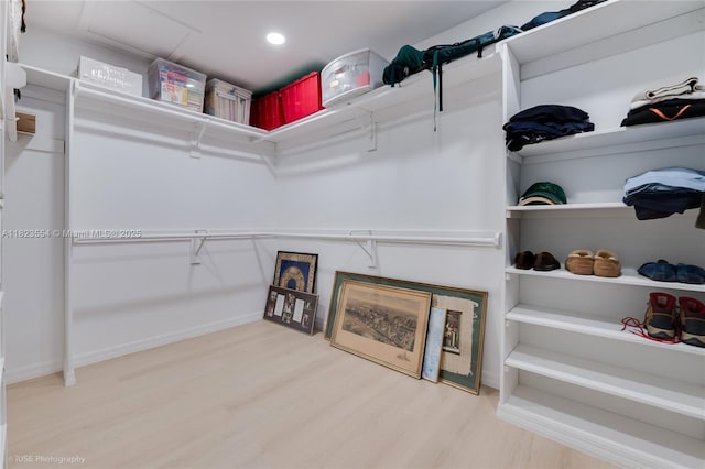 6670 SW 69th Ln, South Miami, FL 33143 - walk in closet featuring wood finished floors and attic access