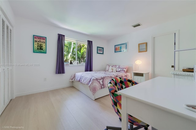 6670 SW 69th Ln, South Miami, FL 33143 - bedroom with light wood-style flooring and baseboards