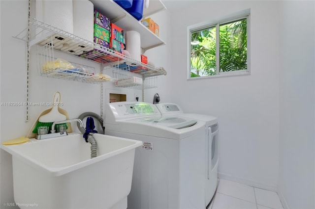 6670 SW 69th Ln, South Miami, FL 33143 - laundry room with washer and dryer and tile patterned flooring