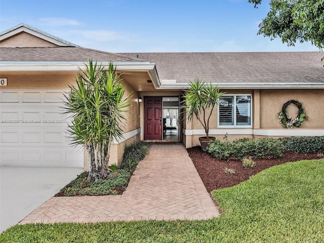 3920 NW 20th St, Coconut Creek, FL 33066 - property entrance with stucco siding, a garage, roof with shingles, and concrete driveway