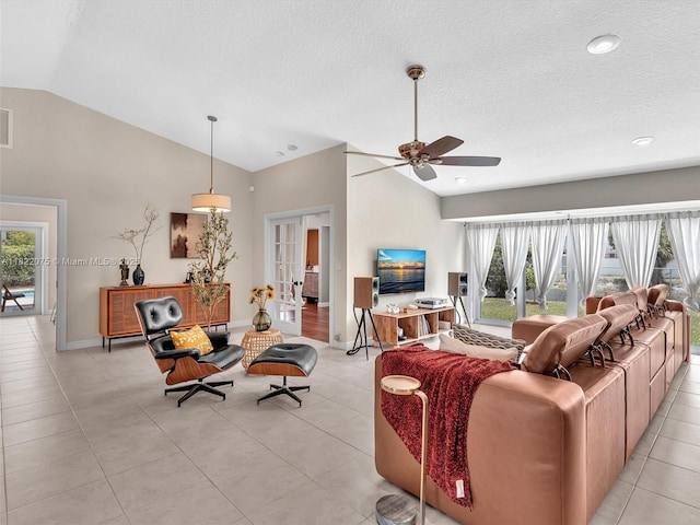 3920 NW 20th St, Coconut Creek, FL 33066 - living room featuring lofted ceiling, ceiling fan, french doors, plenty of natural light, and light tile patterned floors
