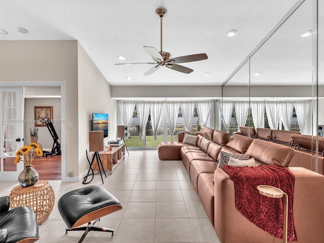 3920 NW 20th St, Coconut Creek, FL 33066 - living room with a ceiling fan, light tile patterned floors, recessed lighting, and a textured ceiling