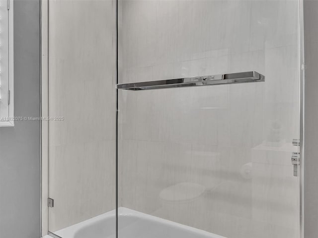 3920 NW 20th St, Coconut Creek, FL 33066 - bathroom featuring bath / shower combo with glass door