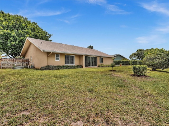 3920 NW 20th St, Coconut Creek, FL 33066 - rear view of house with stucco siding and a yard