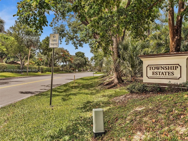 3920 NW 20th St, Coconut Creek, FL 33066 - view of asphalt road featuring traffic signs
