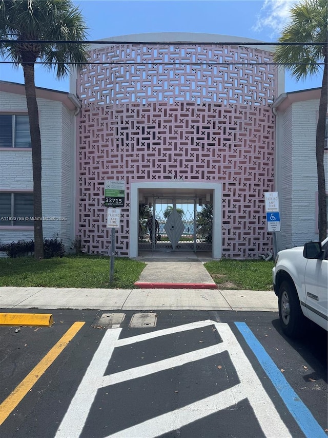 7921 E Dr Unit 8, North Bay Village, FL 33141 - view of property featuring uncovered parking