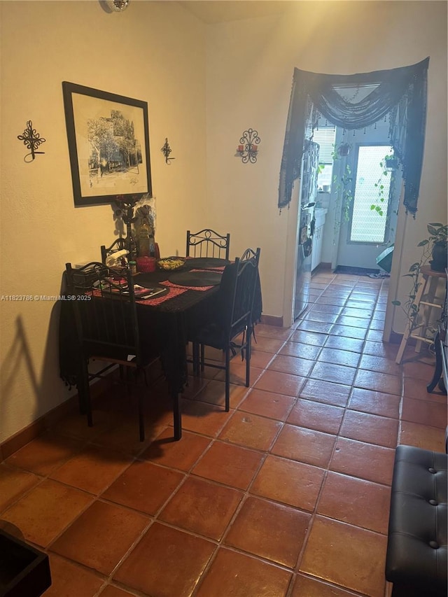 7921 E Dr Unit 8, North Bay Village, FL 33141 - dining room featuring tile patterned flooring and baseboards