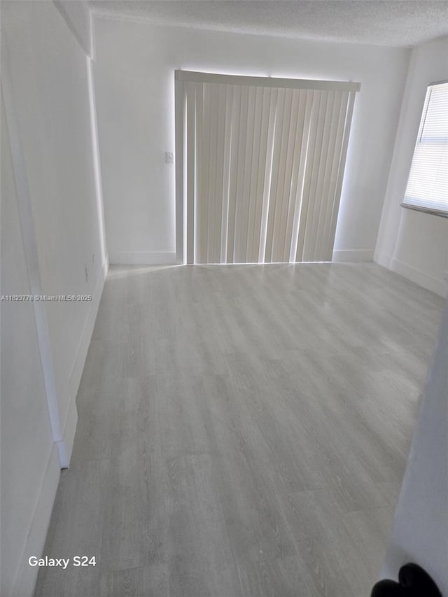 1000 W 28th St Unit 17, Hialeah, FL 33010 - unfurnished room with light wood-type flooring