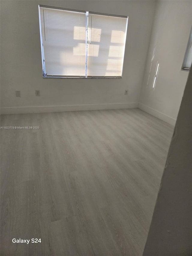 1000 W 28th St Unit 17, Hialeah, FL 33010 - unfurnished room with light wood-style flooring