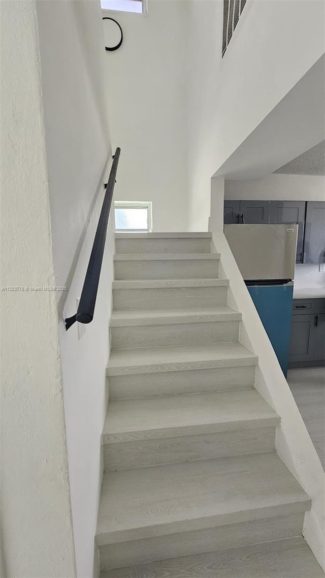 1000 W 28th St Unit 17, Hialeah, FL 33010 - staircase featuring a high ceiling