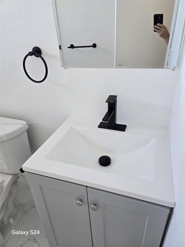 1000 W 28th St Unit 17, Hialeah, FL 33010 - bathroom featuring marble look tile flooring and vanity