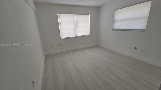 1000 W 28th St Unit 17, Hialeah, FL 33010 - empty room featuring light wood-type flooring and baseboards