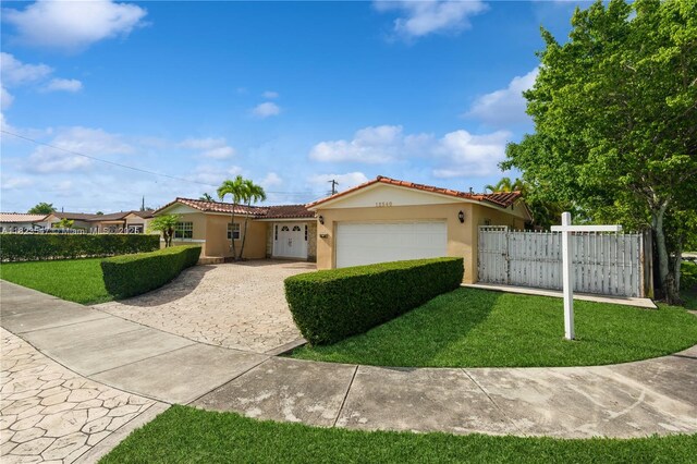 12540 SW 31st St, Miami, FL 33175 - view of front facade featuring stucco siding, an attached garage, driveway, and a tile roof