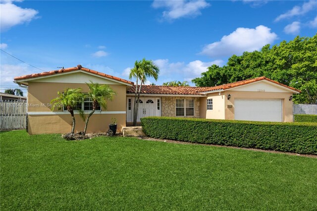 12540 SW 31st St, Miami, FL 33175 - view of front of house featuring stucco siding, an attached garage, and a tiled roof