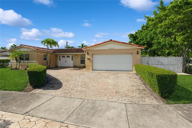 12540 SW 31st St, Miami, FL 33175 - view of front of property with stucco siding, decorative driveway, an attached garage, and a tile roof