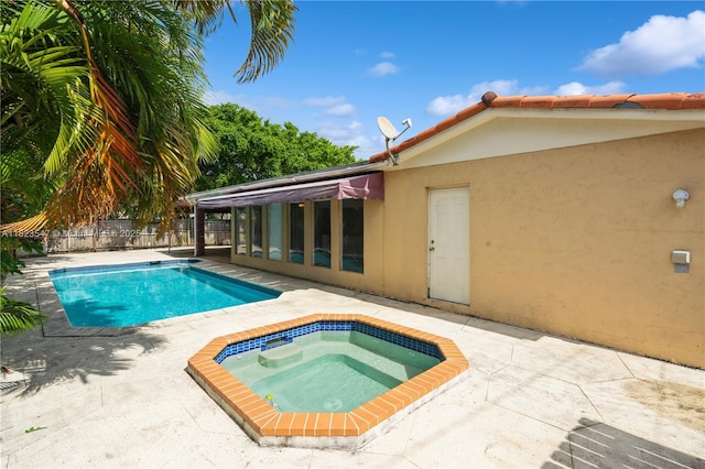 12540 SW 31st St, Miami, FL 33175 - view of pool featuring an in-ground hot tub and a patio