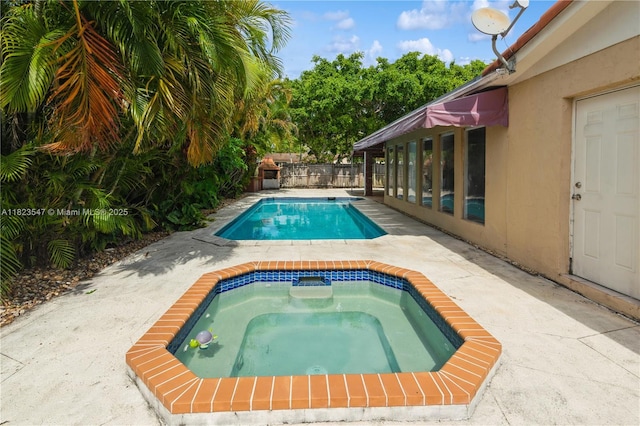 12540 SW 31st St, Miami, FL 33175 - view of pool with an in-ground hot tub and a fenced backyard