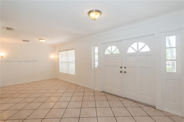 12540 SW 31st St, Miami, FL 33175 - entryway featuring crown molding, plenty of natural light, and light tile patterned floors