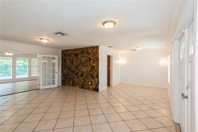12540 SW 31st St, Miami, FL 33175 - spare room featuring crown molding, light tile patterned floors, and french doors