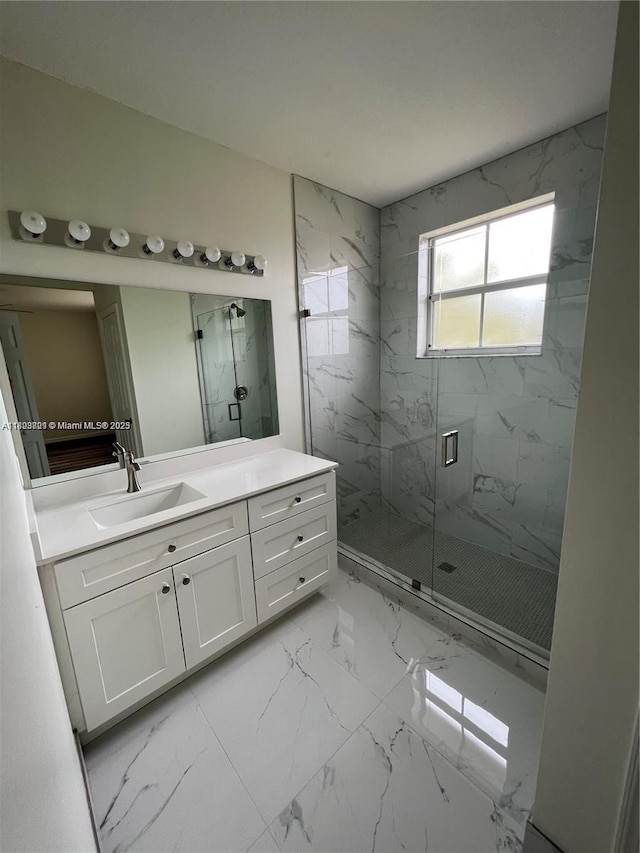 185 Riverwalk Cir, Sunrise, FL 33326 - bathroom with a marble finish shower, marble finish floors, and vanity