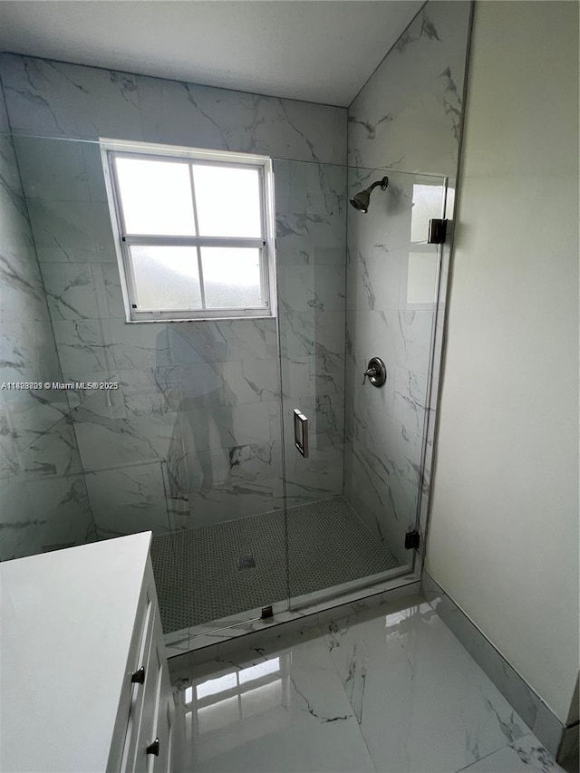 185 Riverwalk Cir, Sunrise, FL 33326 - bathroom with marble look tiles, a marble finish shower, and vanity