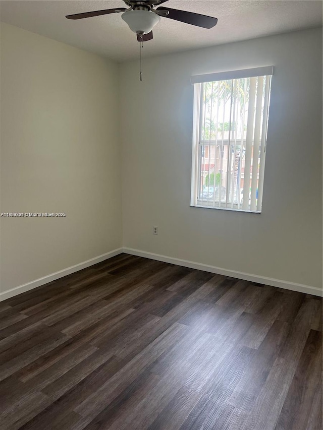 185 Riverwalk Cir, Sunrise, FL 33326 - empty room with a ceiling fan and dark wood-style flooring