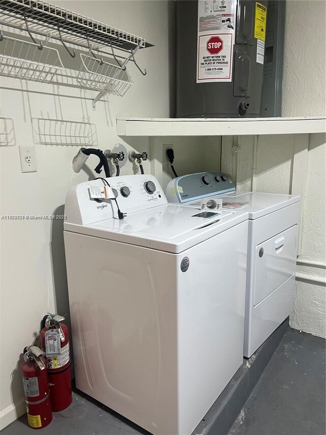185 Riverwalk Cir, Sunrise, FL 33326 - laundry area featuring washer and dryer and a textured wall