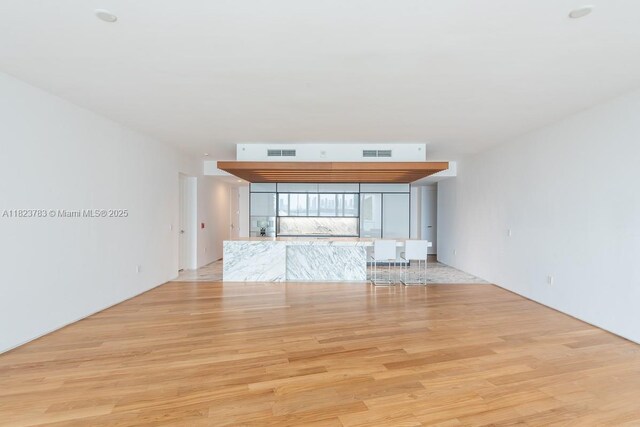 1300 Monad Ter Unit 9D, Miami Beach, FL 33139 - unfurnished living room with light wood finished floors