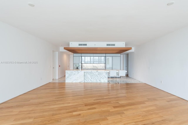 1300 Monad Ter Unit 9D, Miami Beach, FL 33139 - unfurnished living room featuring light wood-style floors