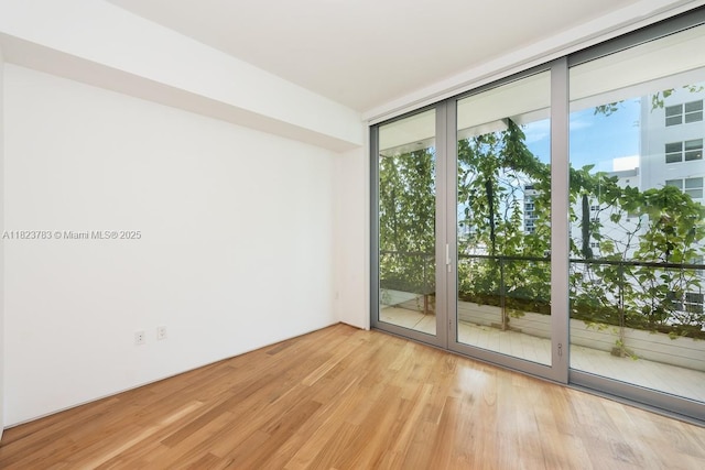 1300 Monad Ter Unit 9D, Miami Beach, FL 33139 - spare room featuring healthy amount of natural light and wood finished floors