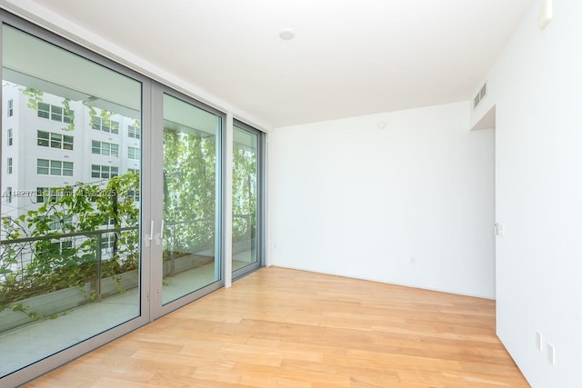 1300 Monad Ter Unit 9D, Miami Beach, FL 33139 - spare room featuring light wood finished floors and expansive windows