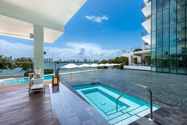 1300 Monad Ter Unit 9D, Miami Beach, FL 33139 - view of pool with a swimming pool, a skyline view, and a hot tub