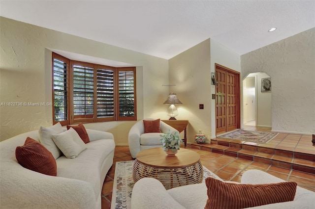 1180 NW 100th Way, Plantation, FL 33322 - tiled living room featuring a textured wall