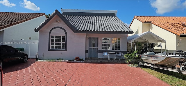 8881 NW 108th Ln, Hialeah Gardens, FL 33018 - back of property with stucco siding and a tiled roof