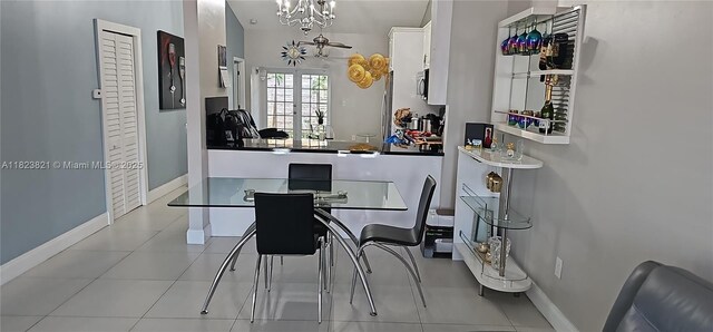 8881 NW 108th Ln, Hialeah Gardens, FL 33018 - dining room with a chandelier and tile patterned floors