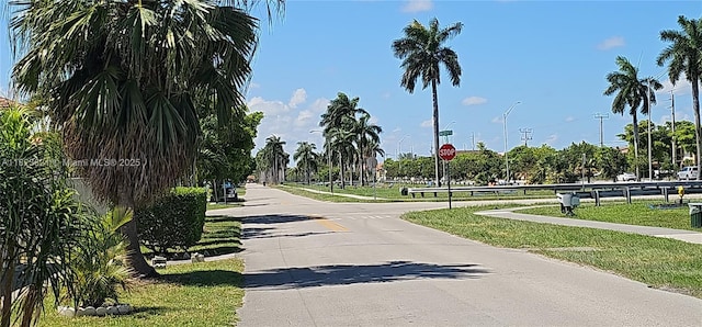 8881 NW 108th Ln, Hialeah Gardens, FL 33018 - view of asphalt road featuring traffic signs and street lights
