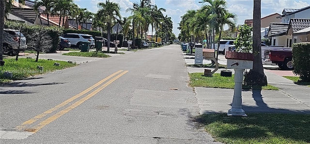 8881 NW 108th Ln, Hialeah Gardens, FL 33018 - view of asphalt road featuring a residential view