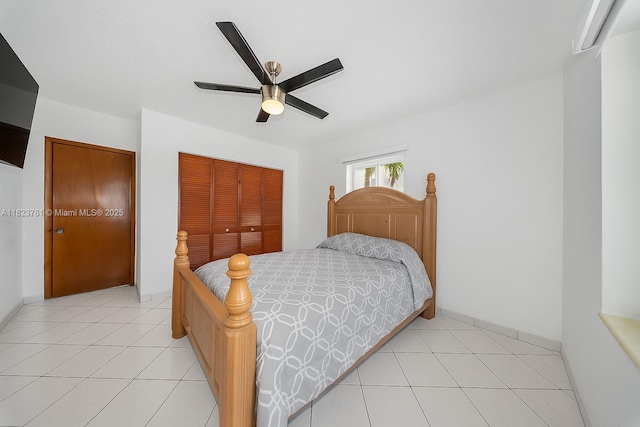 359 E 19th St, Hialeah, FL 33010 - bedroom featuring a closet, light tile patterned floors, and a ceiling fan