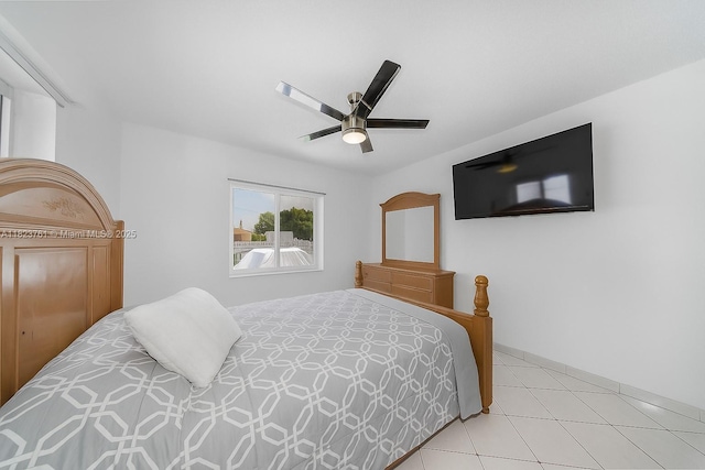 359 E 19th St, Hialeah, FL 33010 - tiled bedroom with a ceiling fan and baseboards