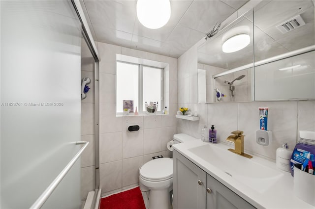 359 E 19th St, Hialeah, FL 33010 - bathroom with tile walls, a tile shower, vanity, and tasteful backsplash