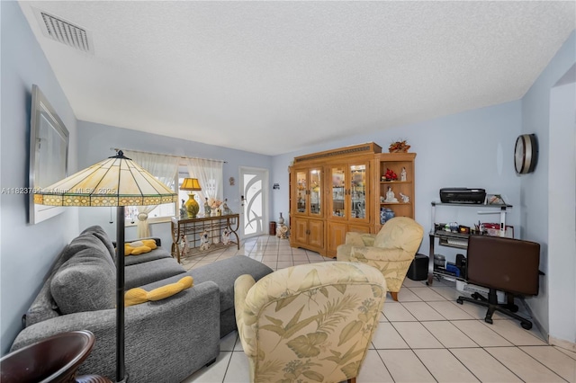 359 E 19th St, Hialeah, FL 33010 - living area featuring light tile patterned floors and a textured ceiling